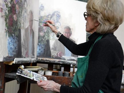 Eileen Hogan working on different versions of her portrait of HRH The Prince of Wales, 2016, photo by Sandra Lousada