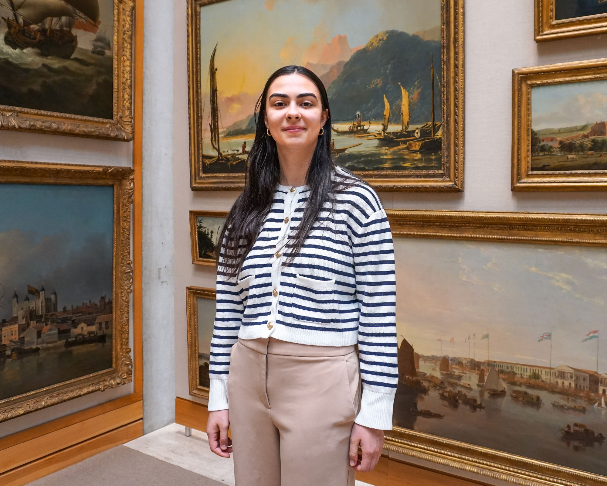 woman in front of artwork