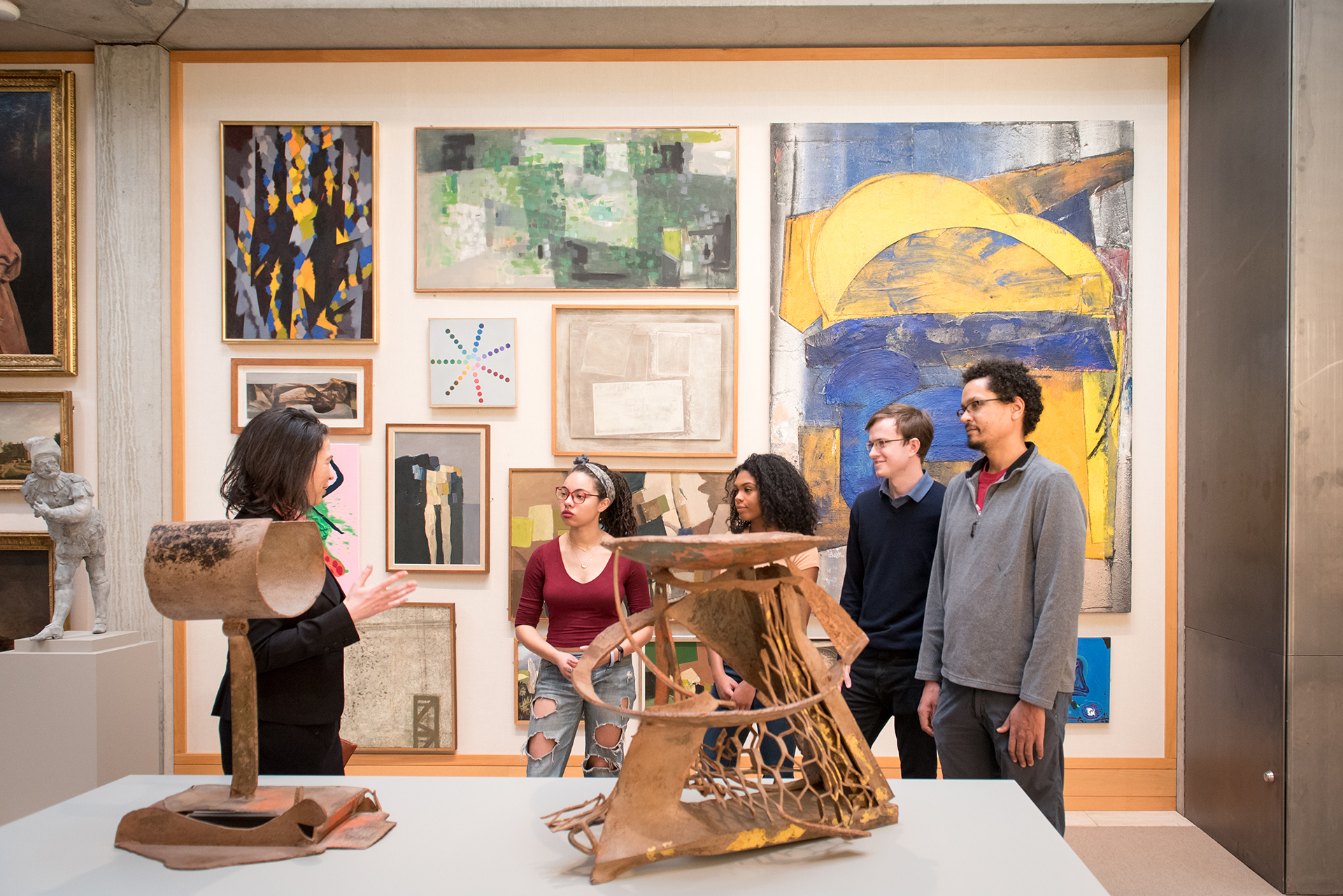 students in conversation in a gallery