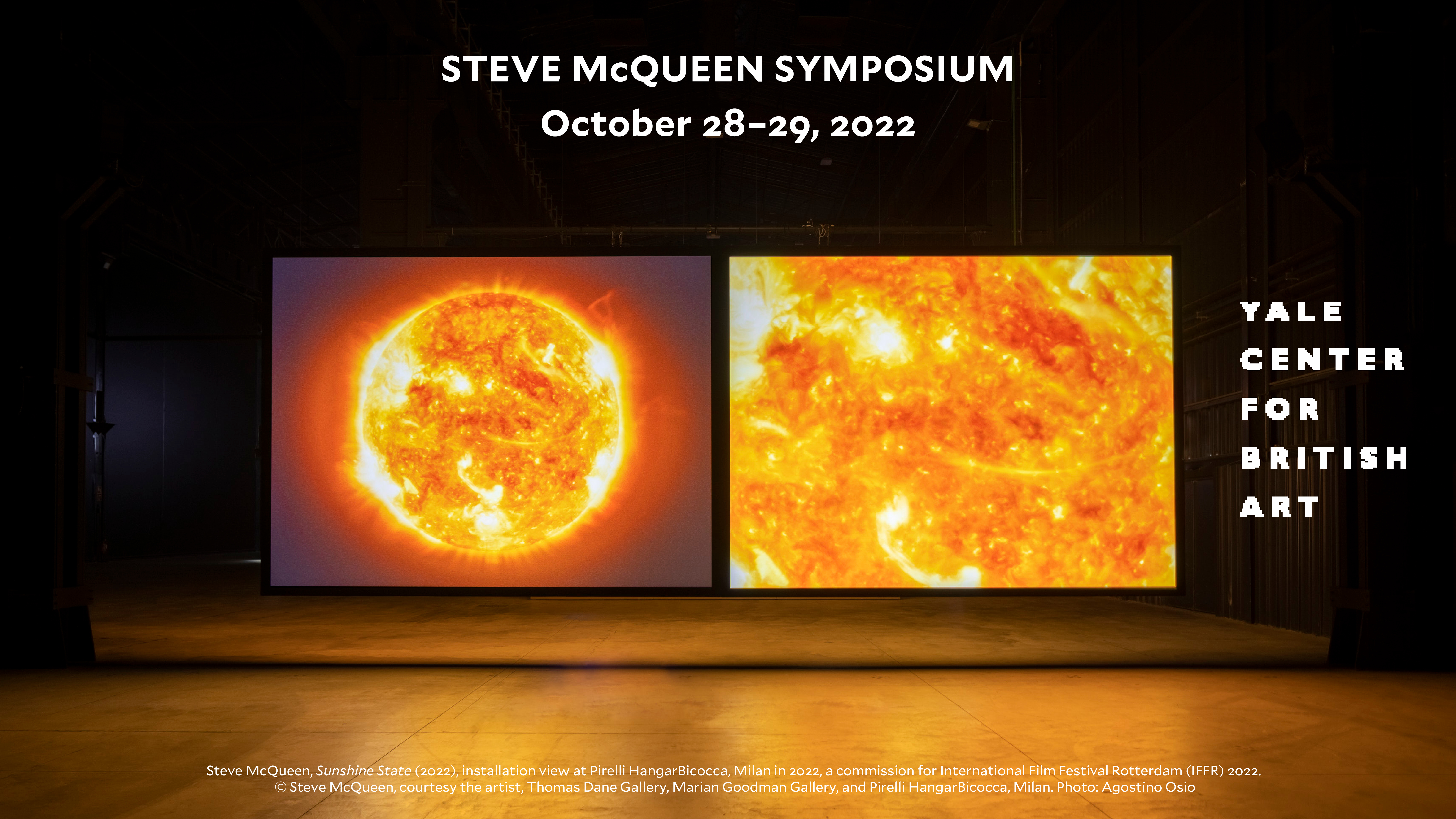 image of an installation of steve mcqueen's work with two screens 