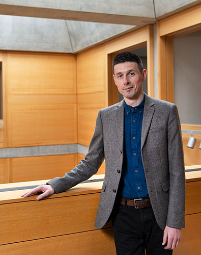 man wearing a tweed blazer