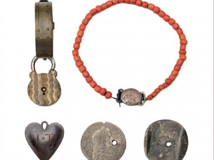 Foundling tokens (left to right): padlock with band; coral necklace; metal engraved heart; punched and notched coin (three pence, silver, reign of King Charles II, 1680), 1680; six pence from the reign of King William III, 1696–97; The Foundling Museum, London, © The Foundling Museum, London