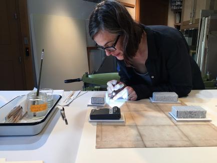 Jessica Makin preforming treatment to an artwork, Yale Center for British Art, photo courtesy of the Conservation Department