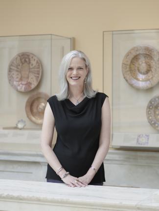 woman wearing black in a gallery