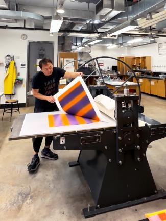 man with a printing press